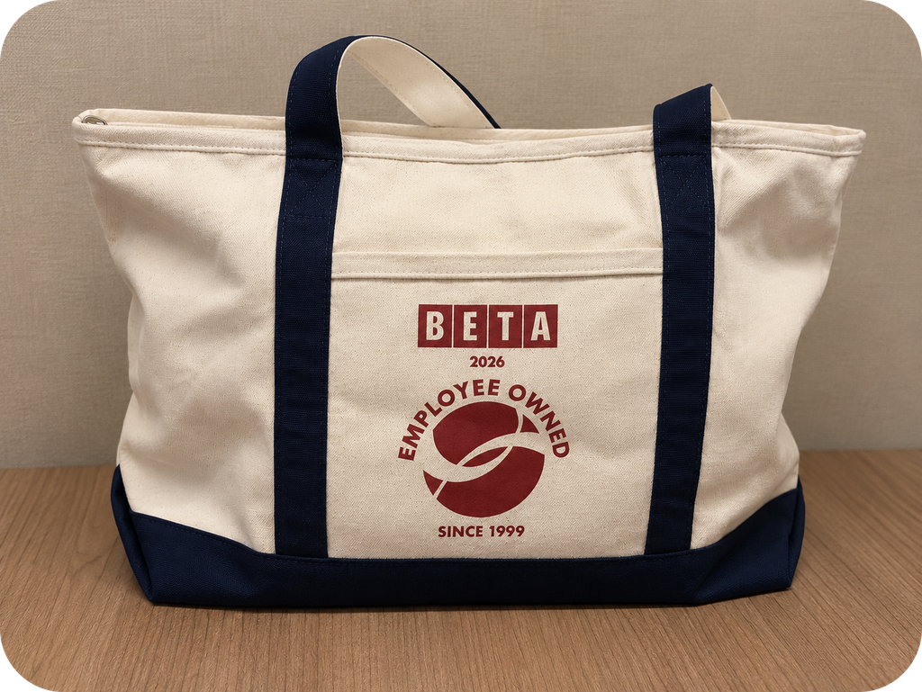 A tote bag with a BETA Employee Ownership logo